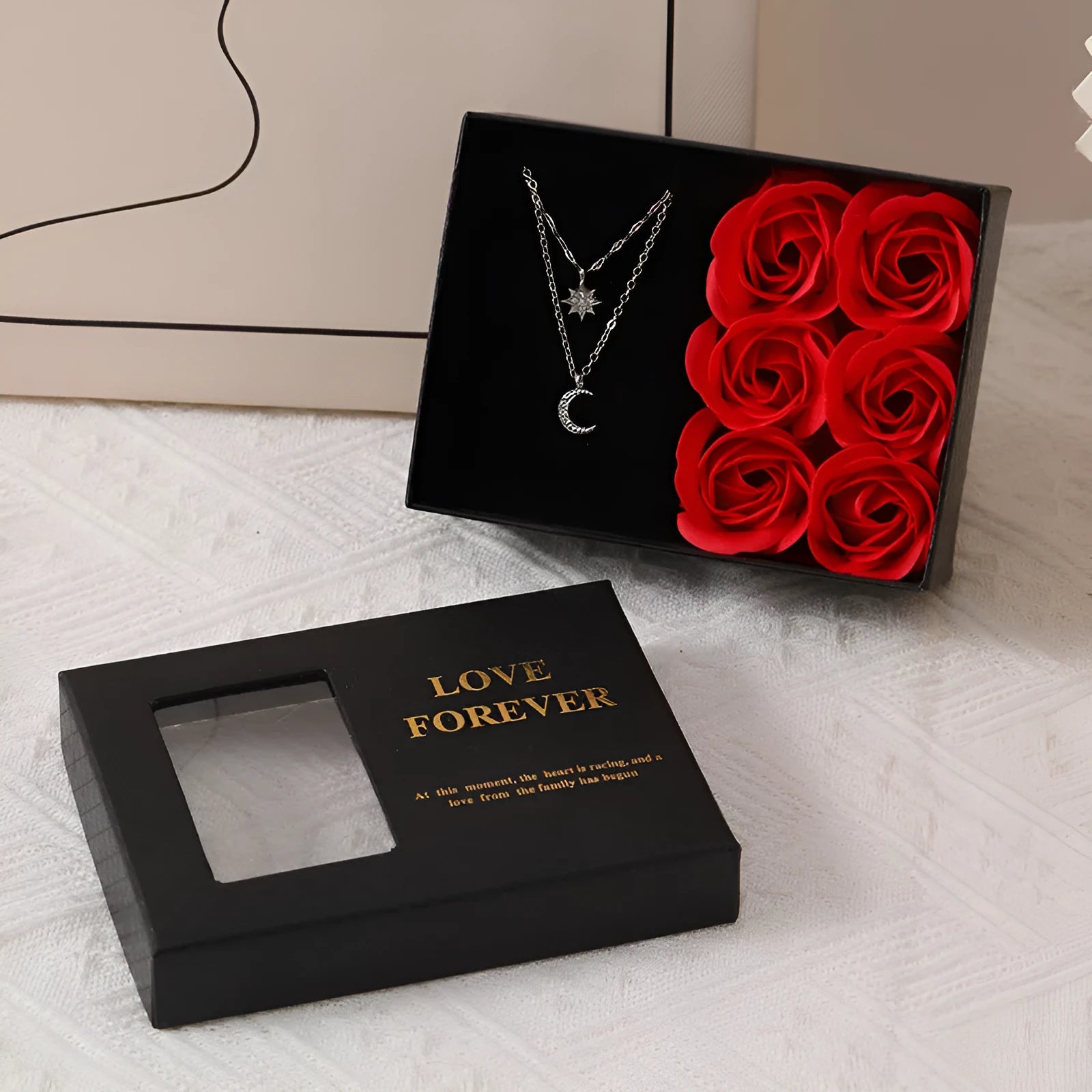 Red Korean style soap flower gift set with six roses in a box next to a matching handbag.