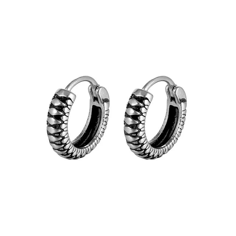 Silver geometric twist earrings with striped pattern and round sports style elements