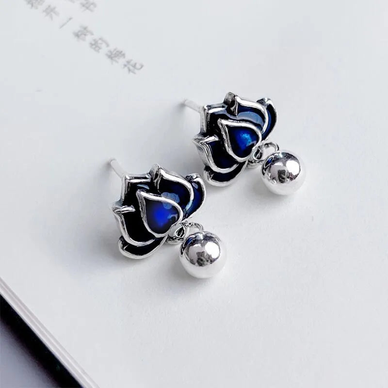 Blue lotus earrings with retro artistic design featuring lotus seedpod tassel detailing on 1.2cm wide ear studs