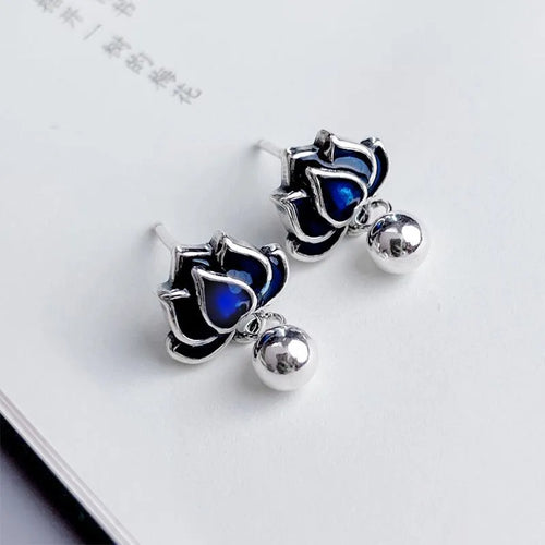 Blue lotus earrings with retro artistic design featuring lotus seedpod tassel detailing on 1.2cm wide ear studs