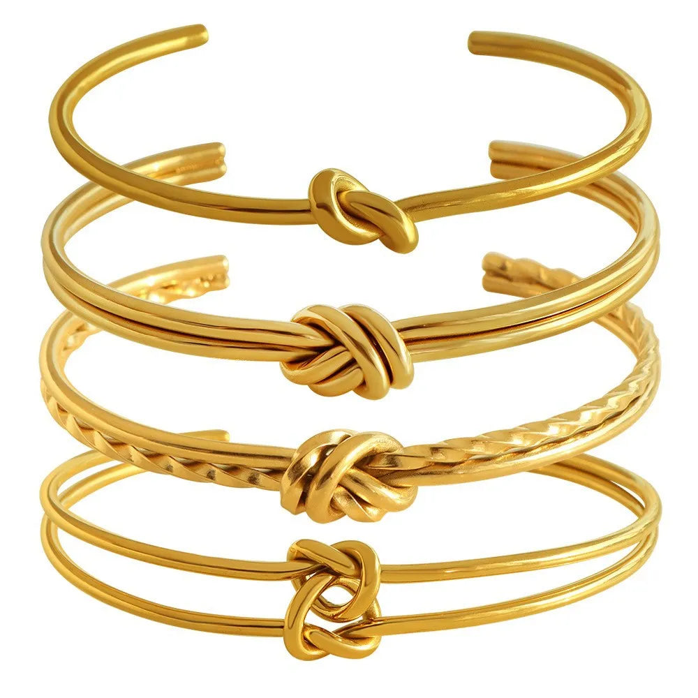 Women's stainless steel bracelet with knotted C-shaped open design in gold plating