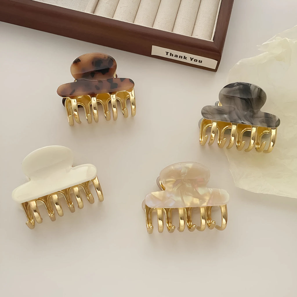 Medium acetate women's hair barrette with metal grip in leopard print retro design