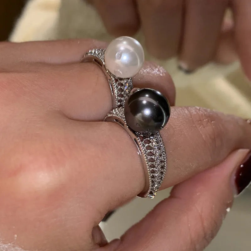 Copper geometric adjustable ring with black pearl finish on feminine hand