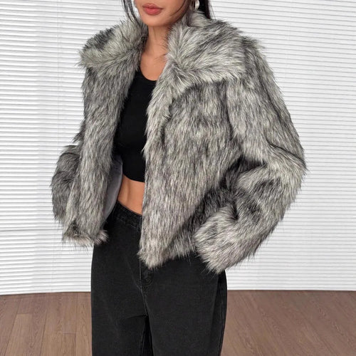 Women's short black artificial fur coat with a full fur collar and long sleeves.