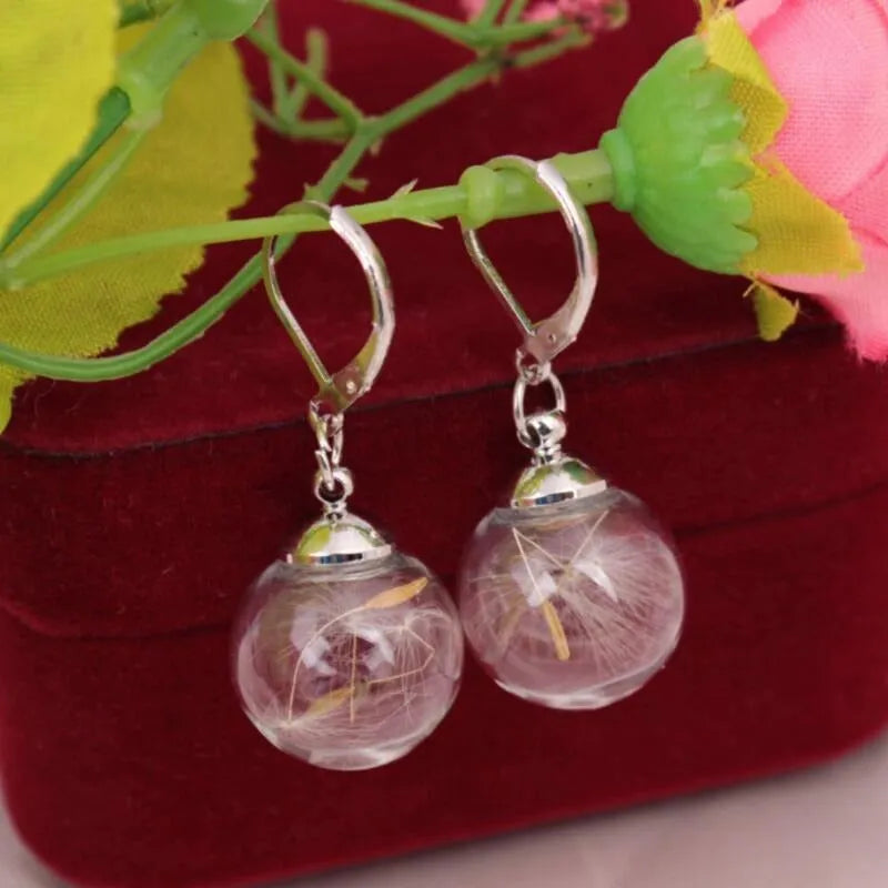 Transparent glass ball earrings with dandelion design and French hook options in silver and bronze finishes