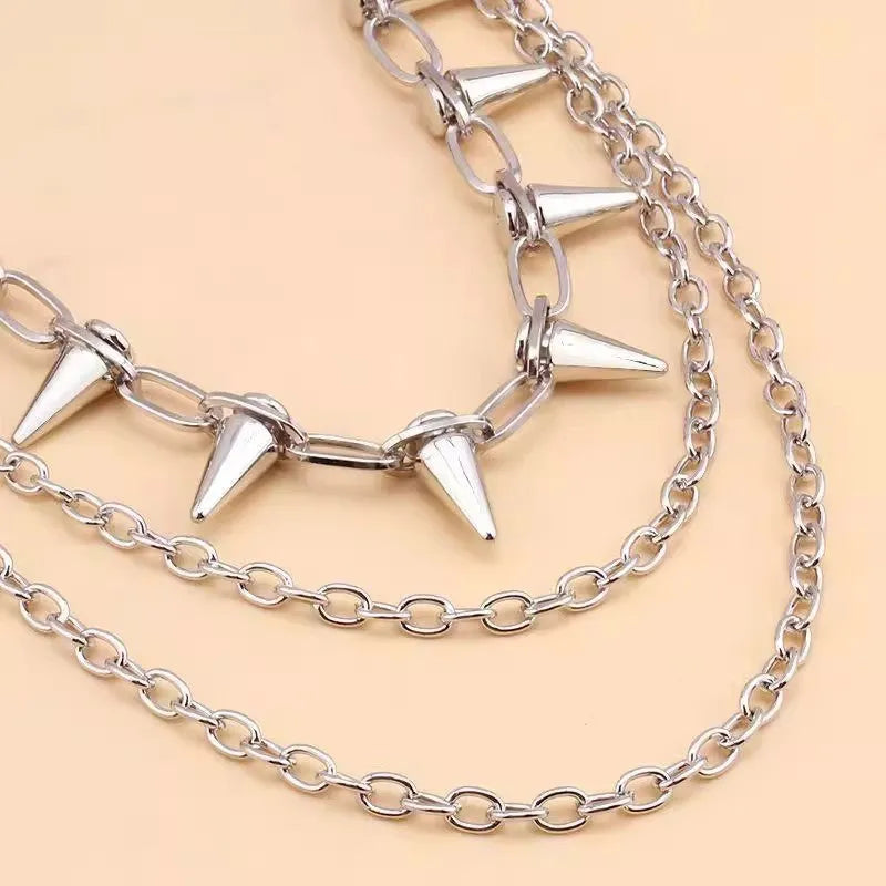 Silver double-layer metal pants chain with rivet details, shown at full 115cm length.