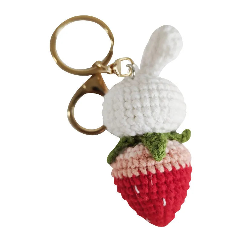 Hand-woven white wire rabbit pendant with strawberry motif and attached key