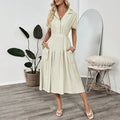 Light green women's shirt dress with a lapel collar, waist tie belt, and a chest pocket.