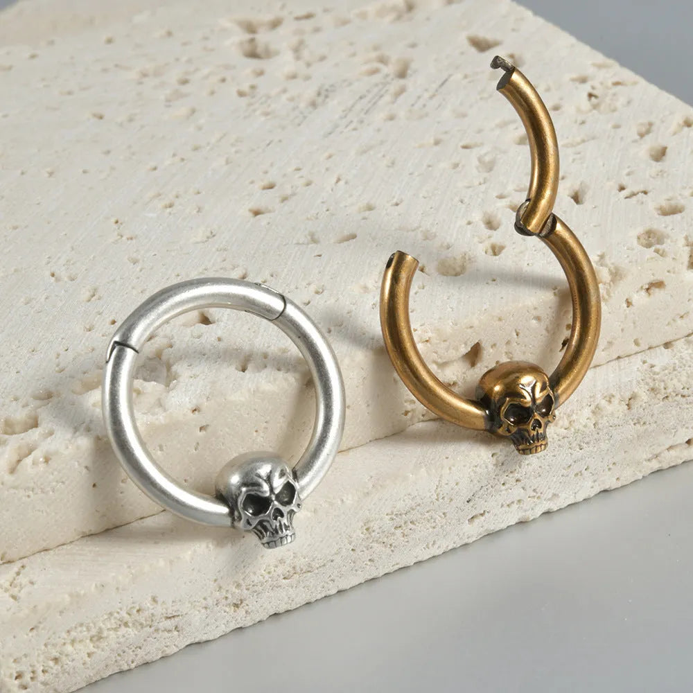 Punk copper earrings with antique ghost head designs in gold and silver finishes