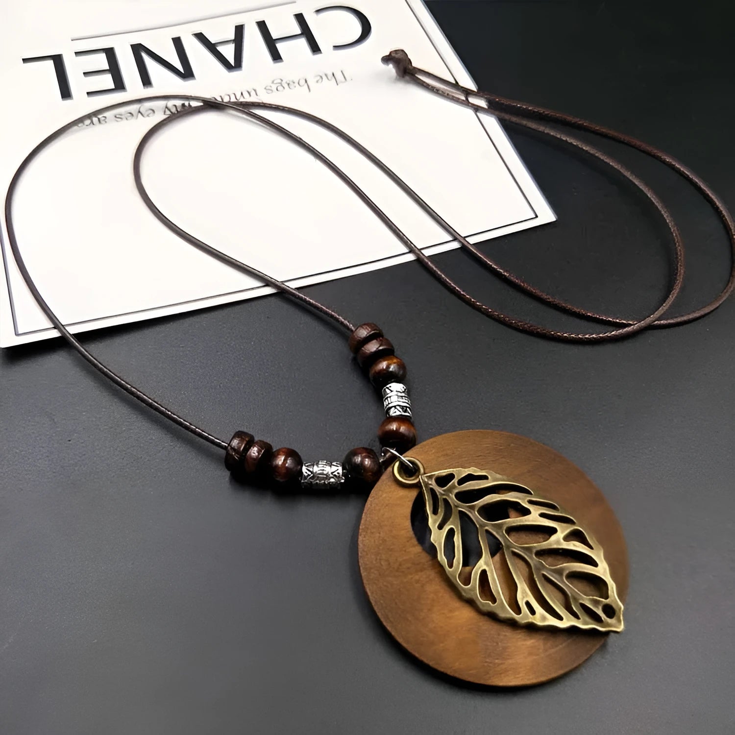 Wooden leaf ethnic necklace with electroplated pendant and adjustable wax line chain measuring 51-80cm