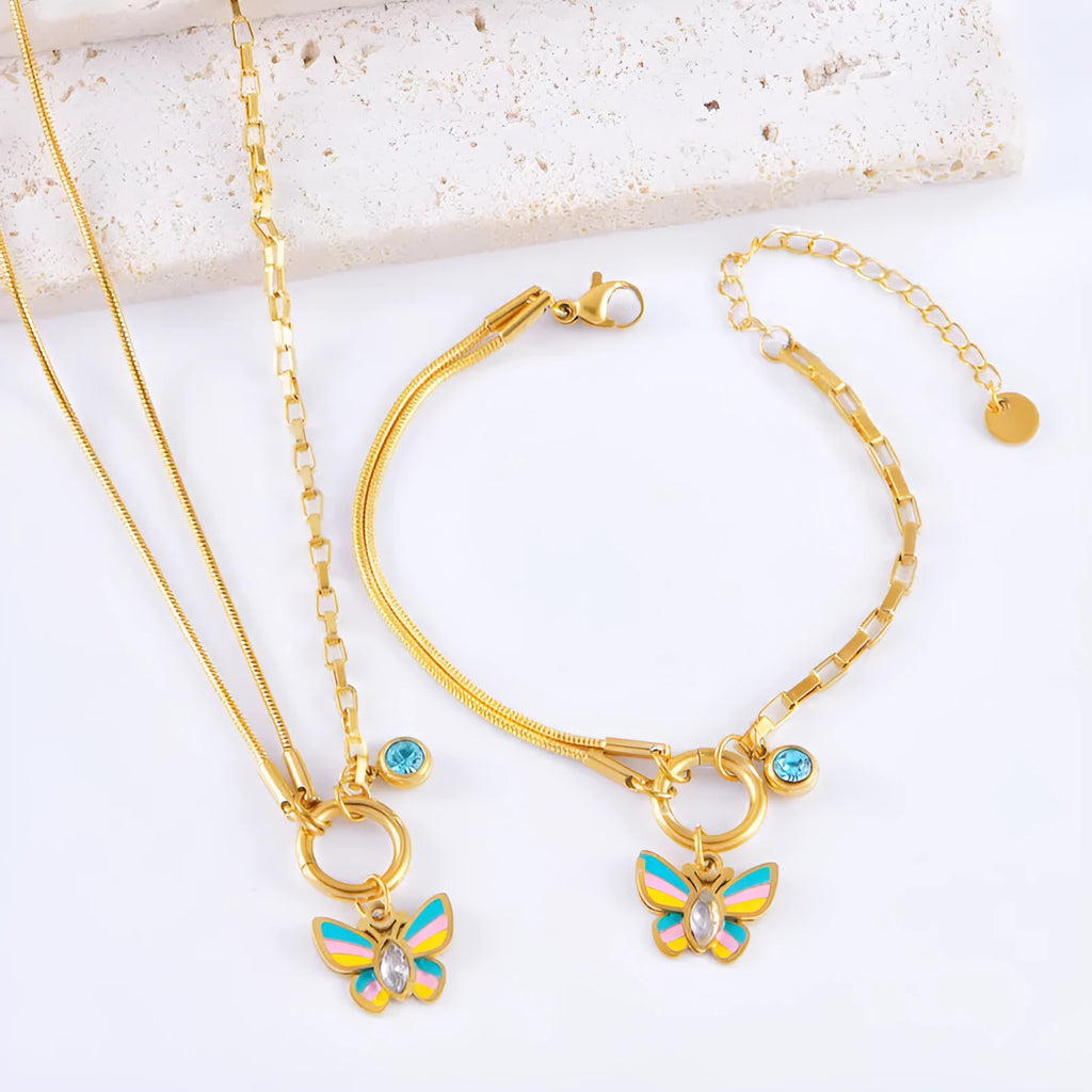 Gold-coloured titanium steel butterfly jewellery set with necklace and bracelet showing epoxy resin pendants