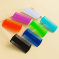 Double-edged fine-toothed plastic flea and lice comb measuring 8cm by 7.5cm
