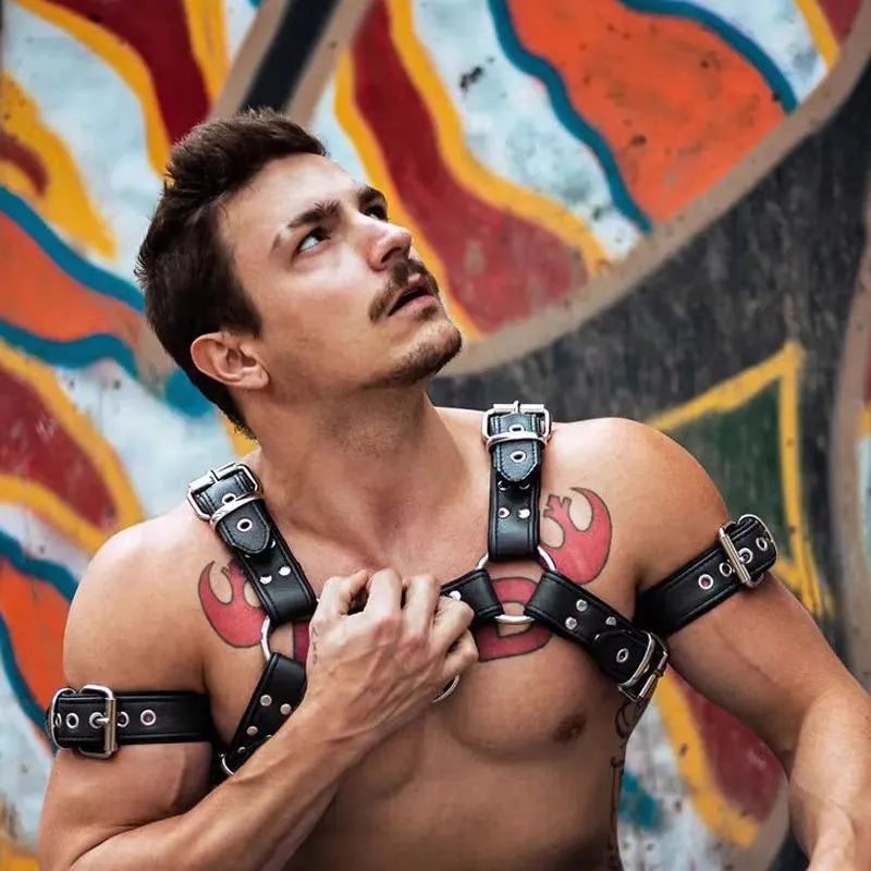Black leather chest muscle bondage strap with metal buckle and adjustable shoulder design