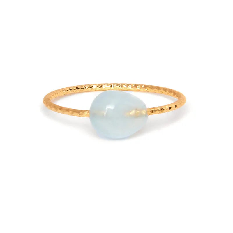 Geometric shaped agate ring for women on a hand, showing original design and coloured stone.