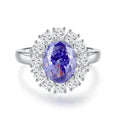 Close-up of a women's heart-shaped sterling silver ring with an ice flower cut tan sang colour zircon stone.