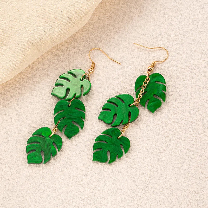 Acrylic drop shape earrings with a coconut design in one of five colour styles on alloy hooks.