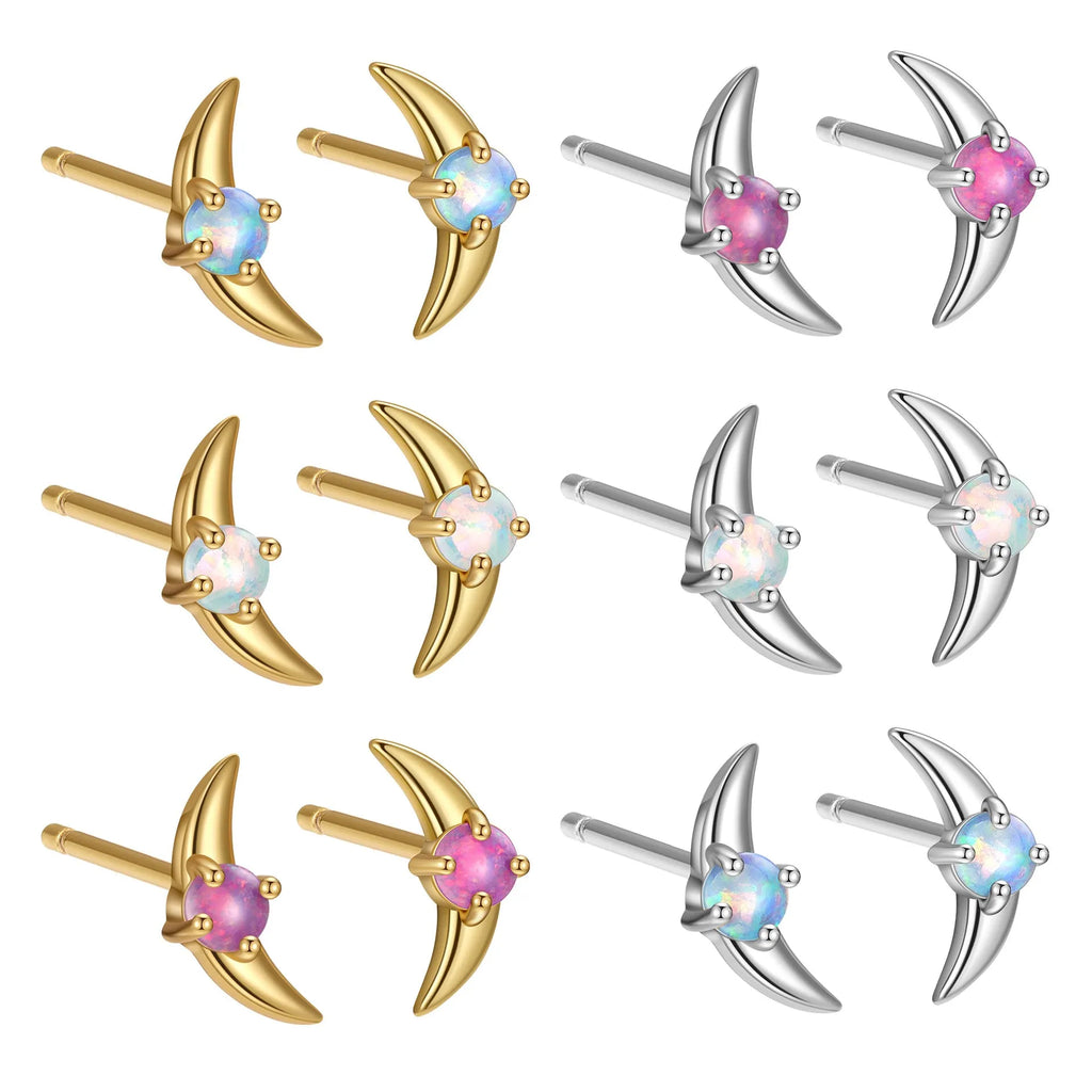 A pair of geometric-shaped 925 silver earrings with a gold colour electroplate and a blue cubic zirconia stone.