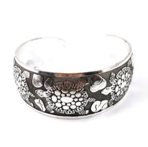 Silver Miao ethnic carved open bracelet with elephant motif on alloy metal