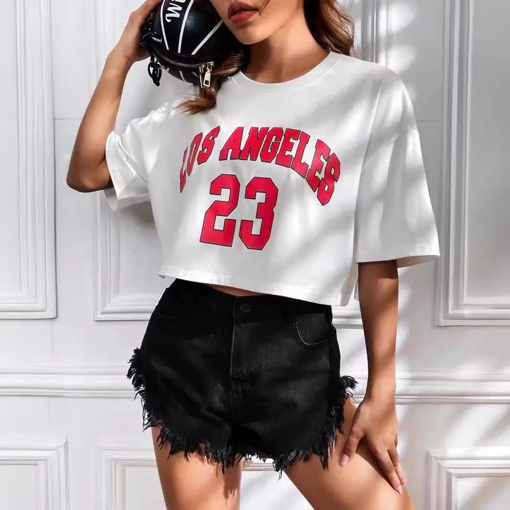 Women's black cotton t-shirt with white printed English letters, loose fit, short sleeves, and exposed navel design.