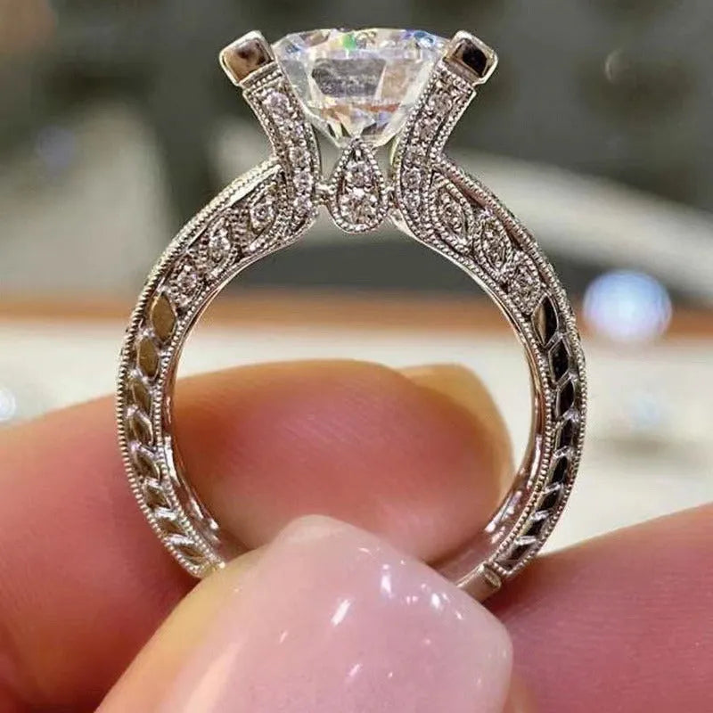 Women's geometric alloy ring with electroplated gold or white finish and round decorative elements
