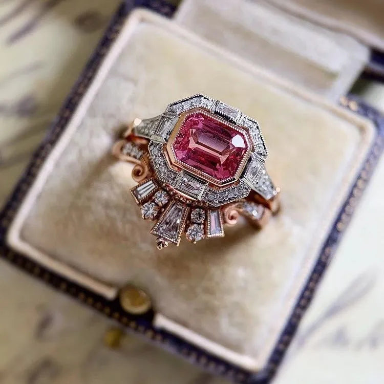 Rose gold geometric women's fashion ring with ruby-style detail in retro design.