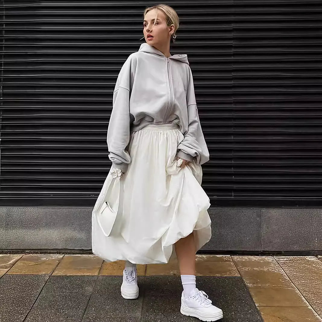 Women's solid colour cotton midi skirt in black or white showing long length