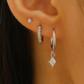 Three-piece ladies earring set with geometric zircon patterns on copper in gold and white colours