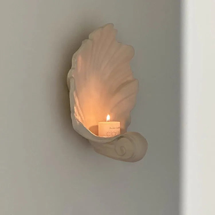 White resin simulation shell fruit plate ornament on a table