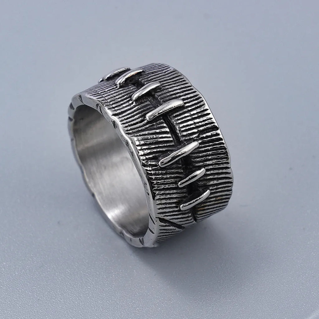 Geometric U-shaped titanium steel punk ring with double-ring design and stitched texture in black.