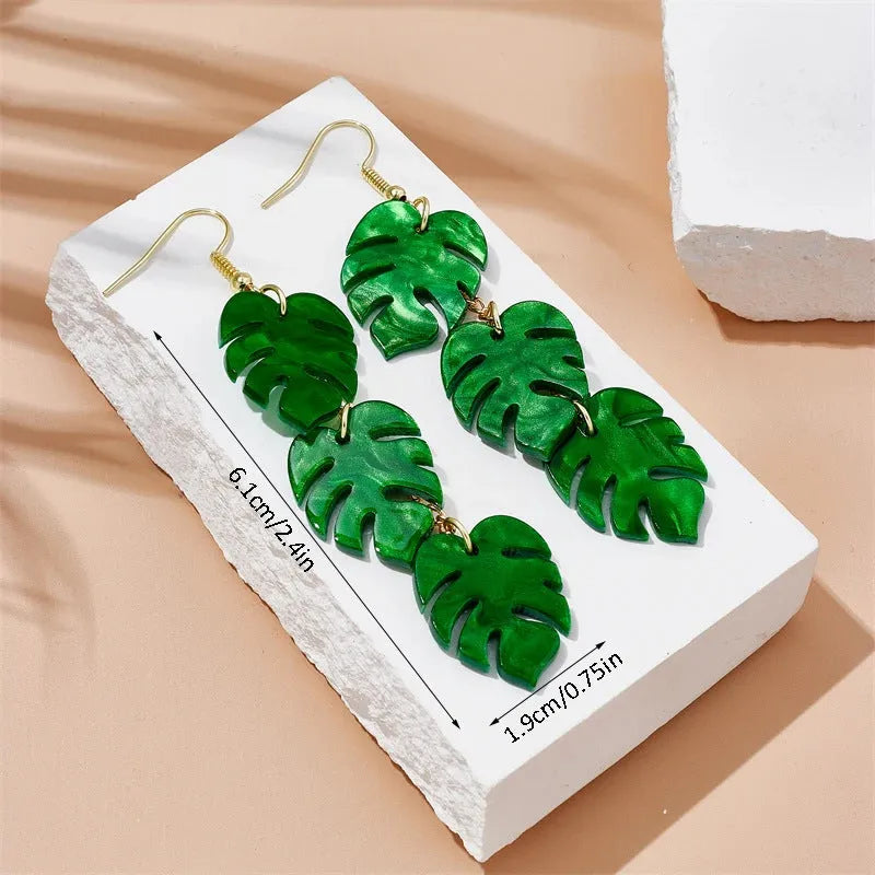 Acrylic drop shape earrings with a coconut design in one of five colour styles on alloy hooks.