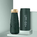 Closed five-fold mini pocket sun umbrella showing compact size and rubber handle