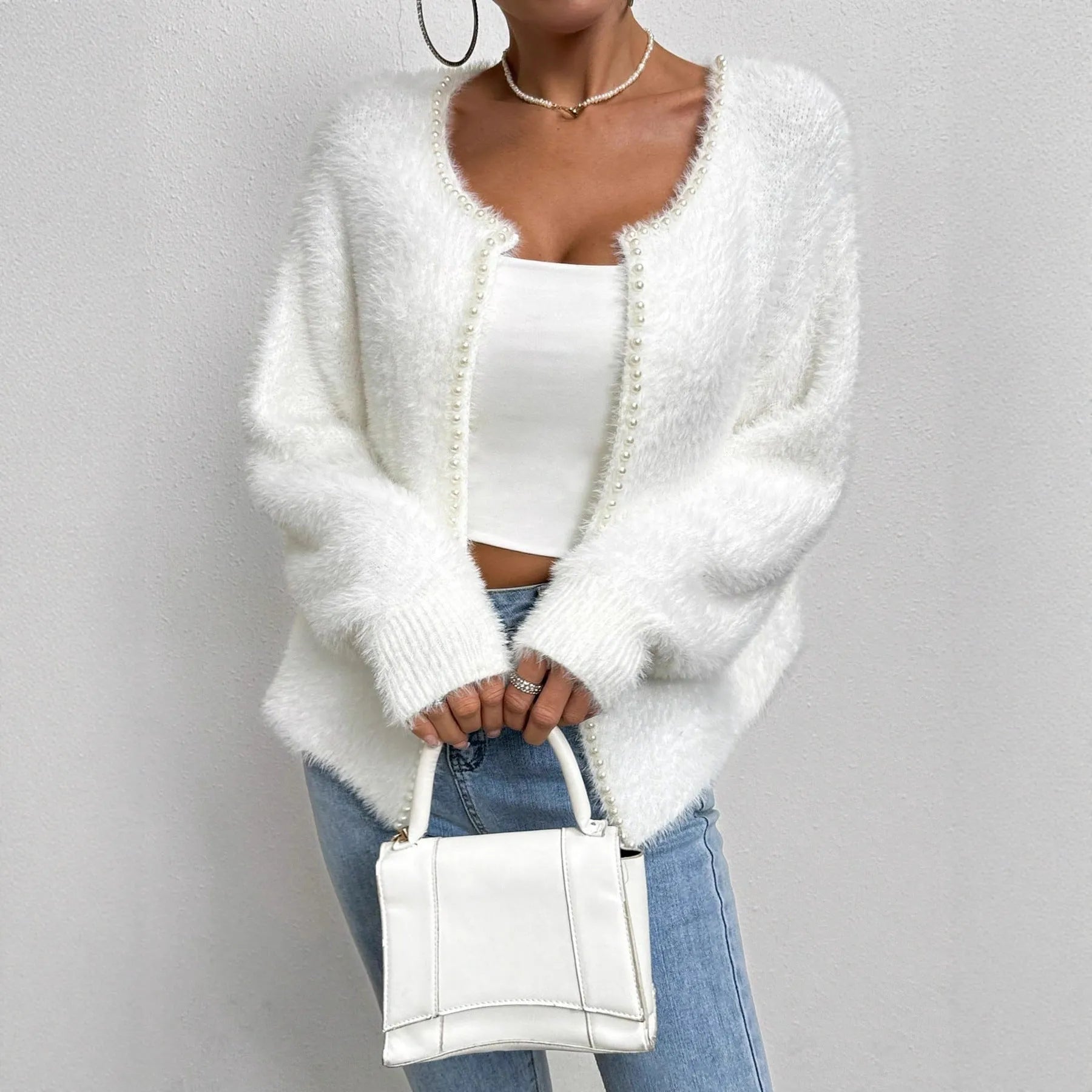 White women's V-neck cardigan sweater in polyester knit fabric