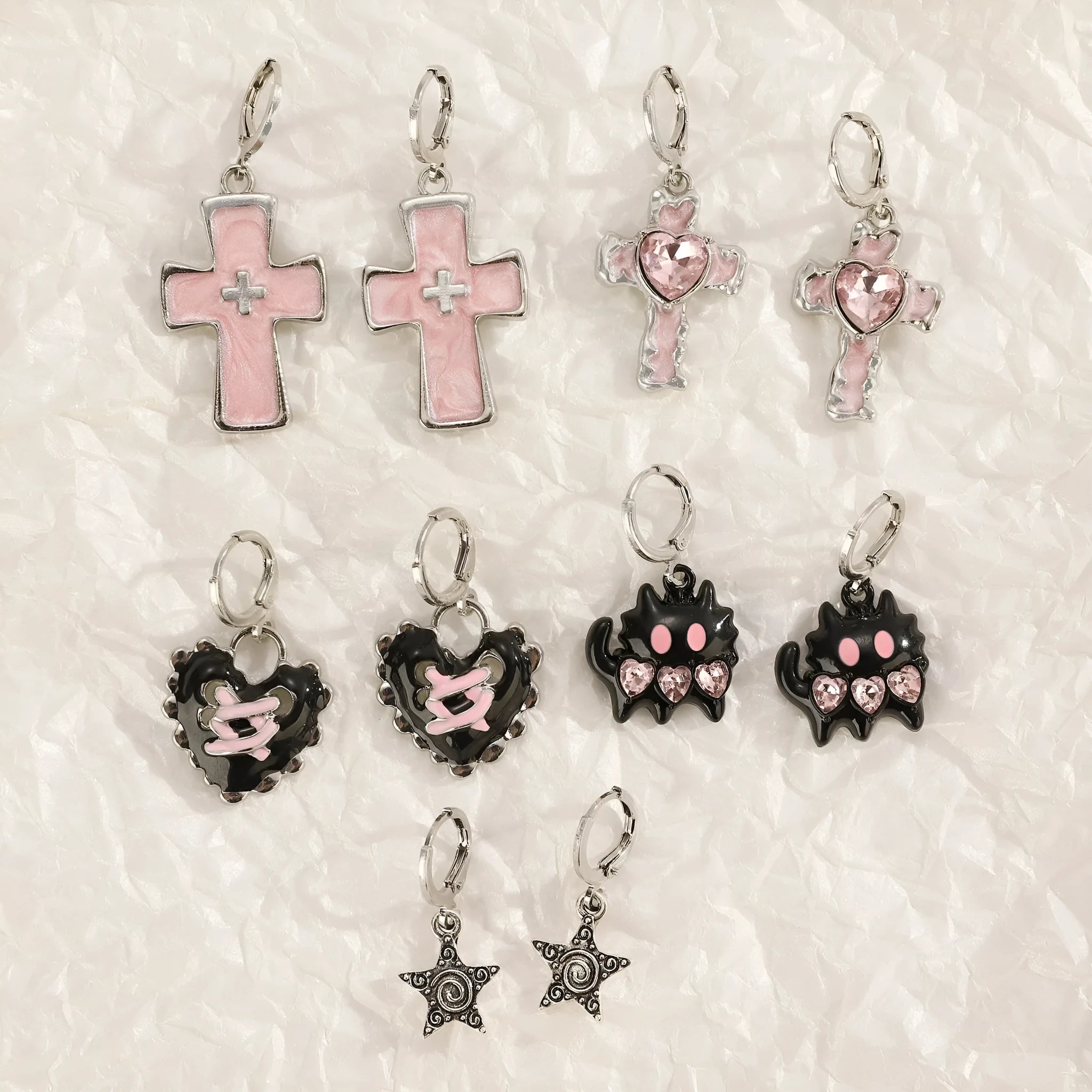 Women's alloy earrings in cross, heart and animal designs with multiple colour options