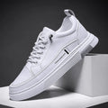 Men's white low-top skateboard shoes with elastic band closure and round toe