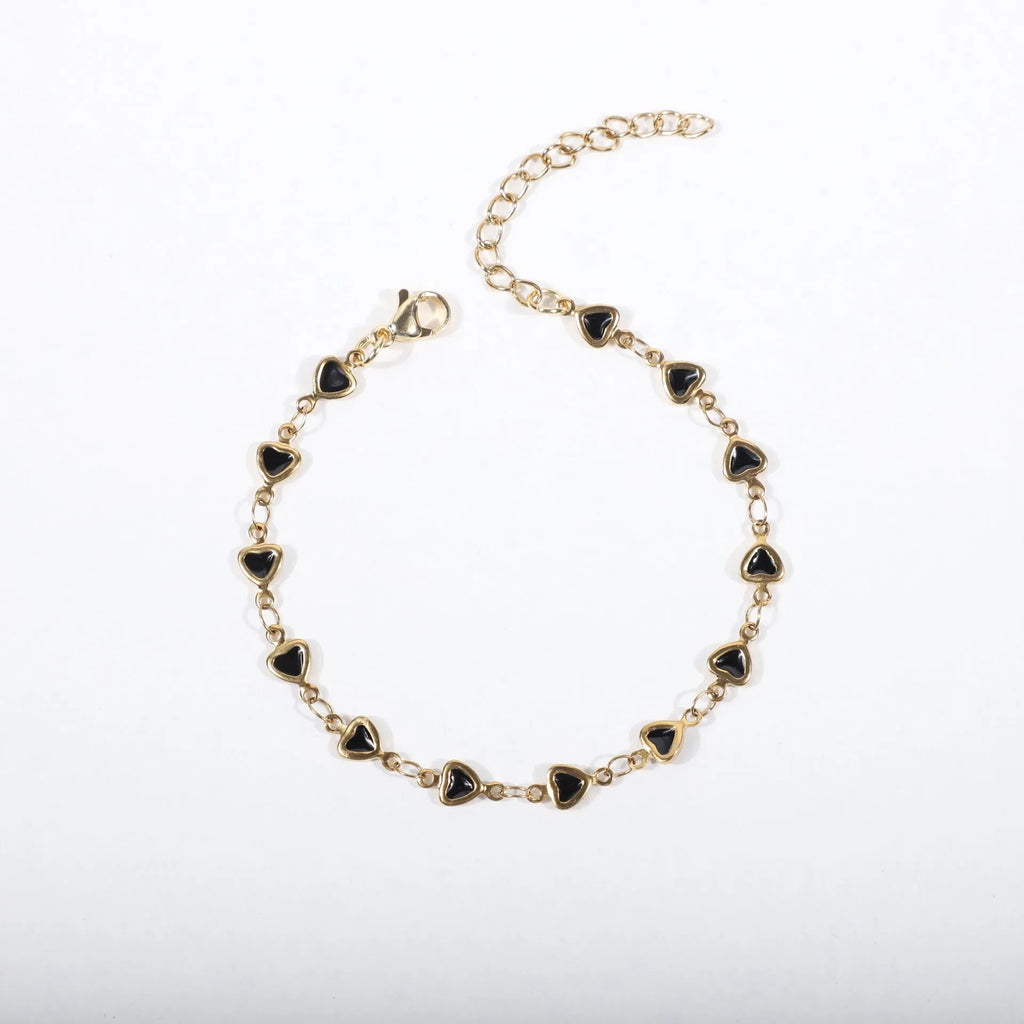 Adjustable stainless steel heart bracelet with 18K gold plating in multiple colour options showing length adjustment