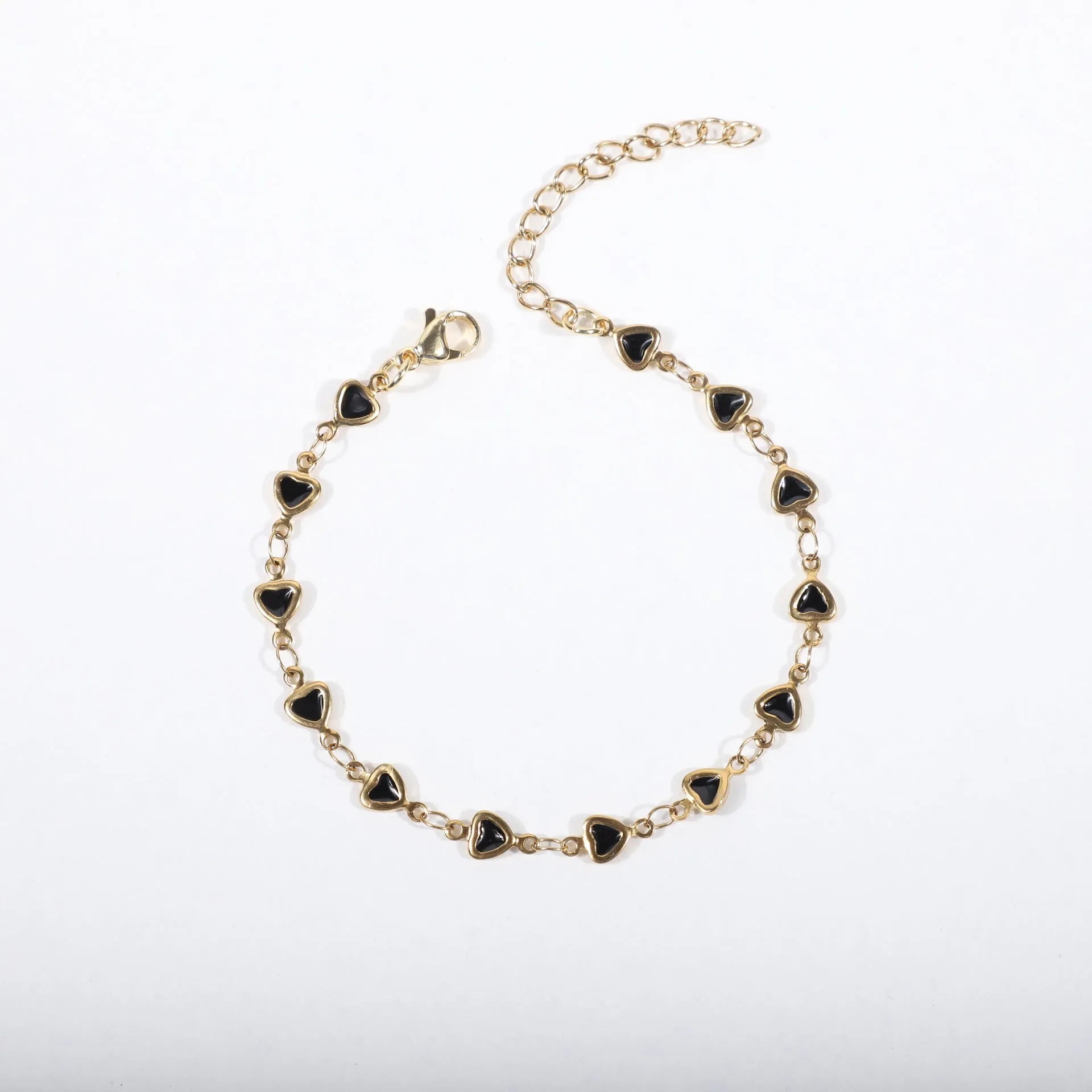 Adjustable stainless steel heart bracelet with 18K gold plating in multiple colour options showing length adjustment