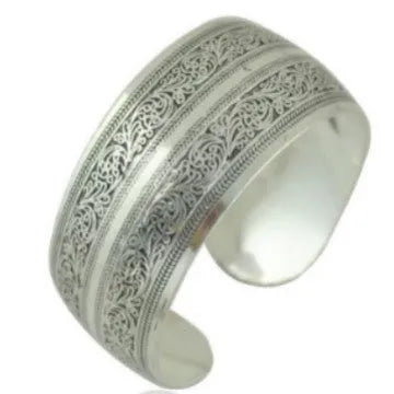 Silver Miao ethnic carved open bracelet with elephant motif on alloy metal