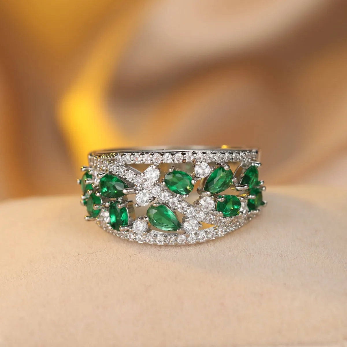 Women's round hollow copper fashion ring with a choice of platinum or gold finish and white or blue stone.