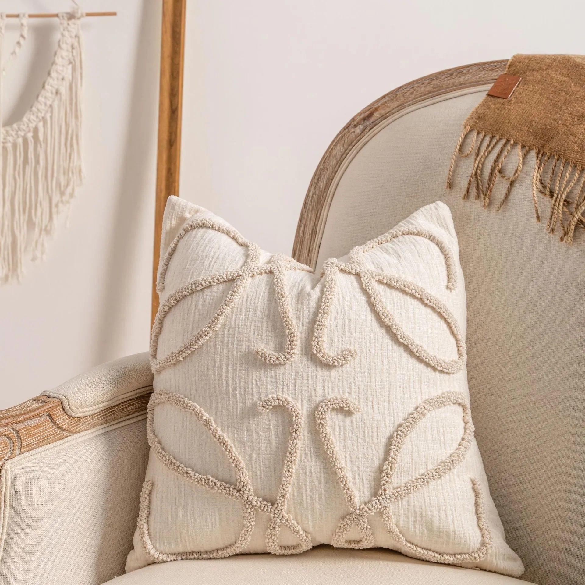 Knitted cushion cover with tassel trim in a striped pattern, shown in a choice of colours including spiral dots and woven rabbit fur.