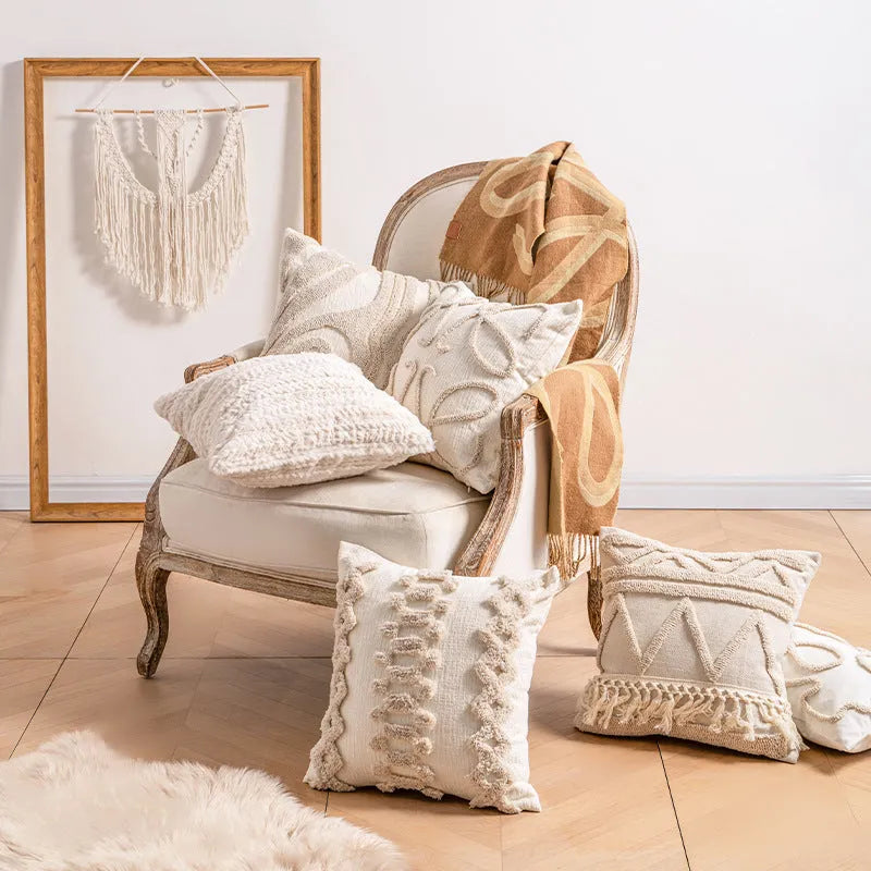Knitted cushion cover with tassel trim in a striped pattern, shown in a choice of colours including spiral dots and woven rabbit fur.