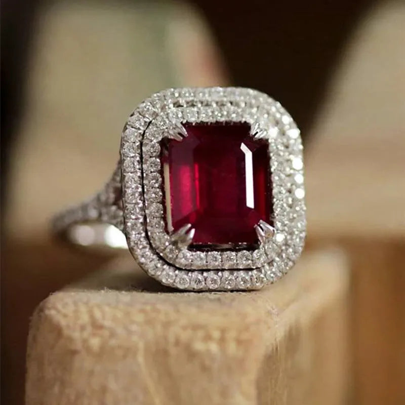 Copper women's ring with a square red rhinestone in a geometric setting.