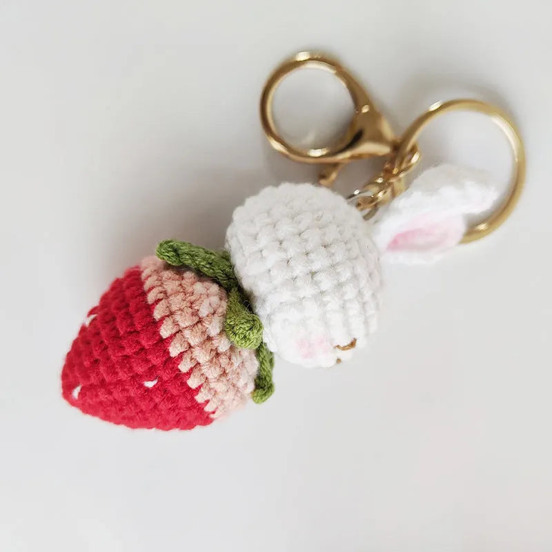 Hand-woven white wire rabbit pendant with strawberry motif and attached key