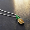 Silver geometric pineapple pendant necklace with diamond crystal details on women's model
