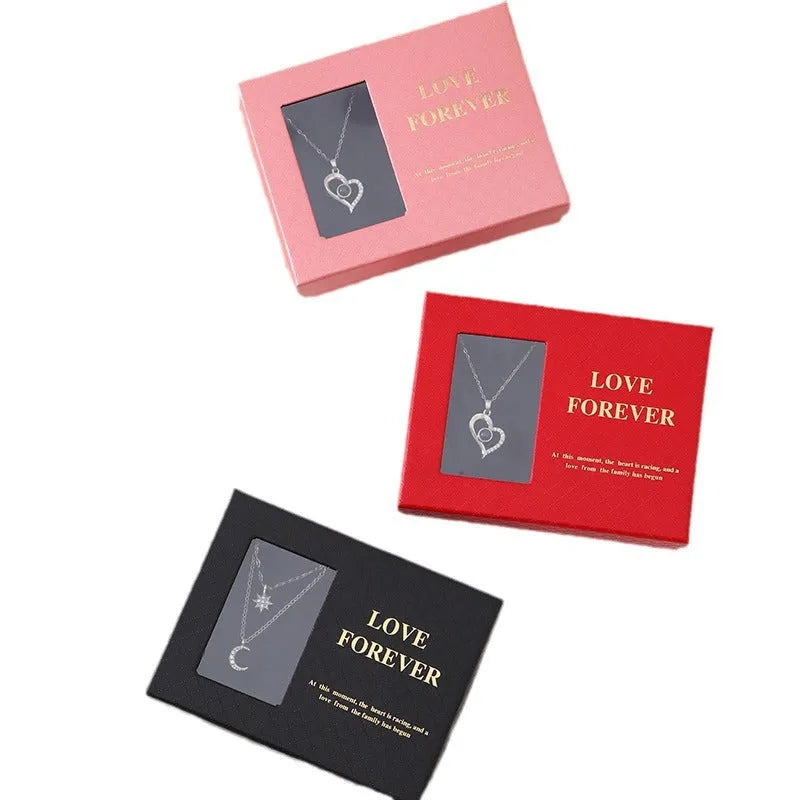 Red Korean style soap flower gift set with six roses in a box next to a matching handbag.