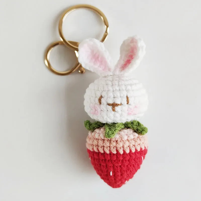 Hand-woven white wire rabbit pendant with strawberry motif and attached key