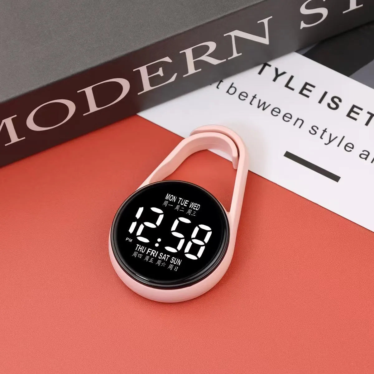 LED digital wristwatch showing time and week day on display, with plastic strap.