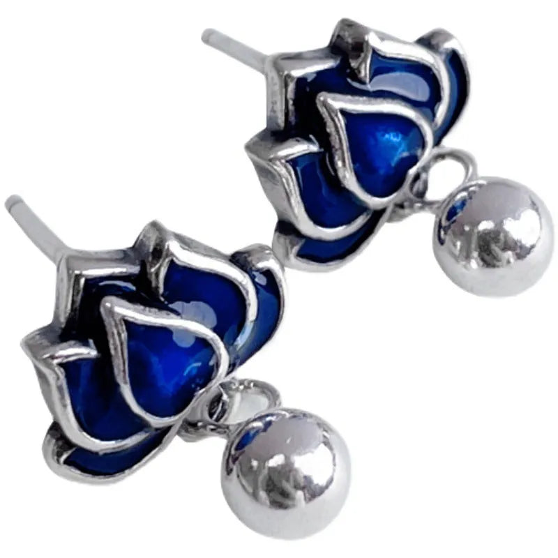 Blue lotus earrings with retro artistic design featuring lotus seedpod tassel detailing on 1.2cm wide ear studs