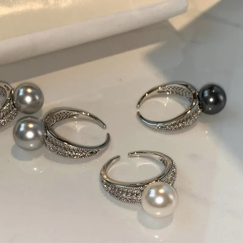 Copper geometric adjustable ring with black pearl finish on feminine hand