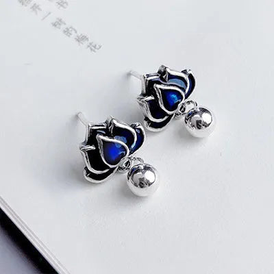 Blue lotus earrings with retro artistic design featuring lotus seedpod tassel detailing on 1.2cm wide ear studs