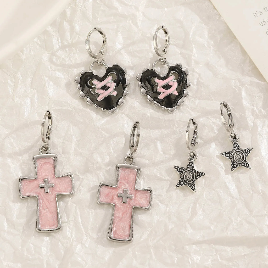 Women's alloy earrings in cross, heart and animal designs with multiple colour options